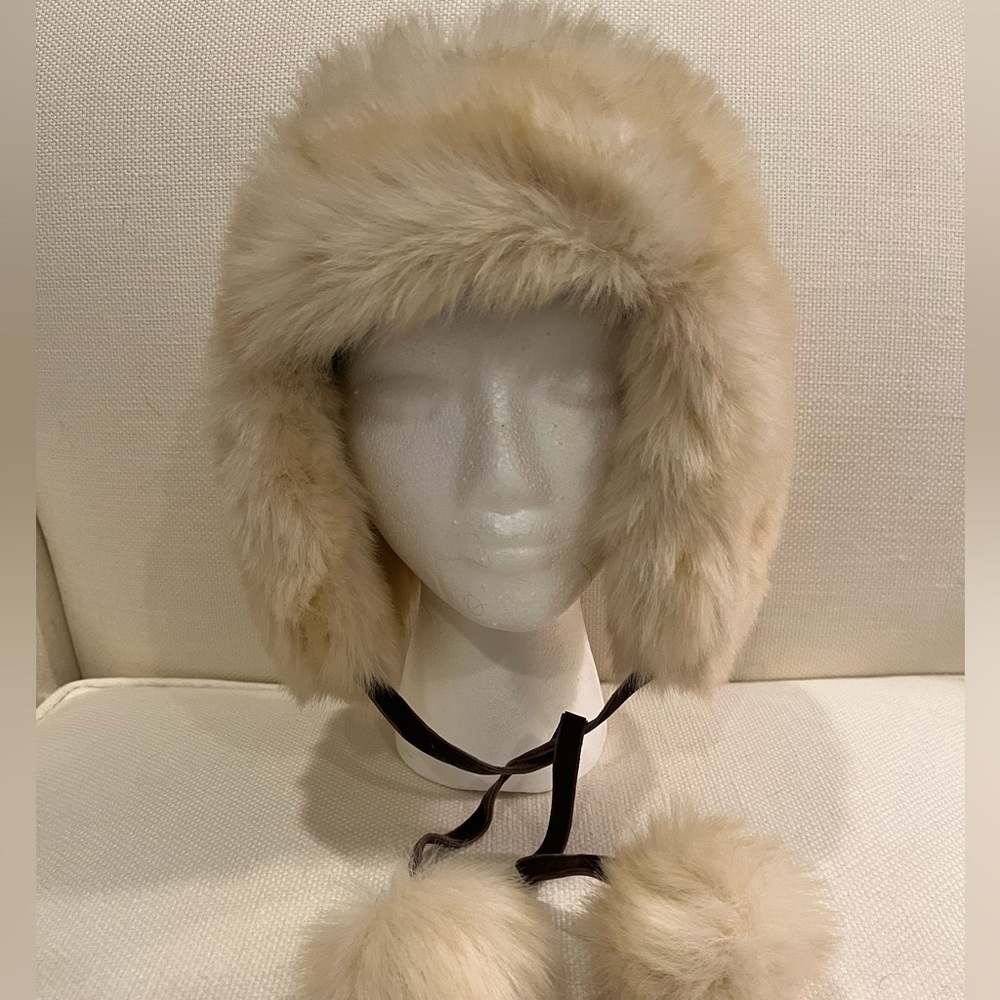 Gap faux-fur hat with tassels and quilted lining.